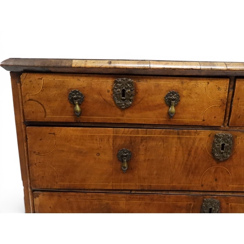 2024 - A 17TH CENTURY WILLIAM AND MARY WALNUT VENEERED CHEST OF DRAWERSwith satinwood inlaid top over two s... 