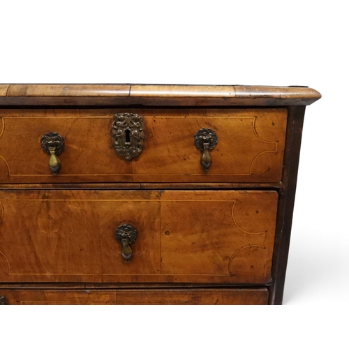2024 - A 17TH CENTURY WILLIAM AND MARY WALNUT VENEERED CHEST OF DRAWERSwith satinwood inlaid top over two s... 