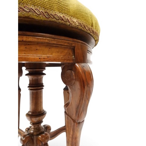 2027 - A PAIR OF 19TH CENTURY WALNUT RISE AND FALL PIANO STOOLS&nbsp;with circular mustard floral tapestry ... 