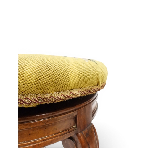 2027 - A PAIR OF 19TH CENTURY WALNUT RISE AND FALL PIANO STOOLS&nbsp;with circular mustard floral tapestry ... 