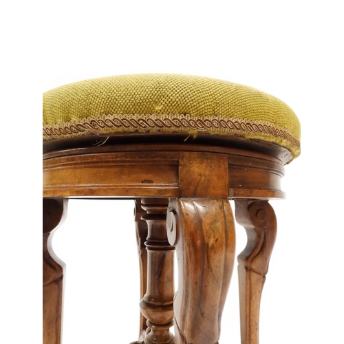 2027 - A PAIR OF 19TH CENTURY WALNUT RISE AND FALL PIANO STOOLS&nbsp;with circular mustard floral tapestry ... 