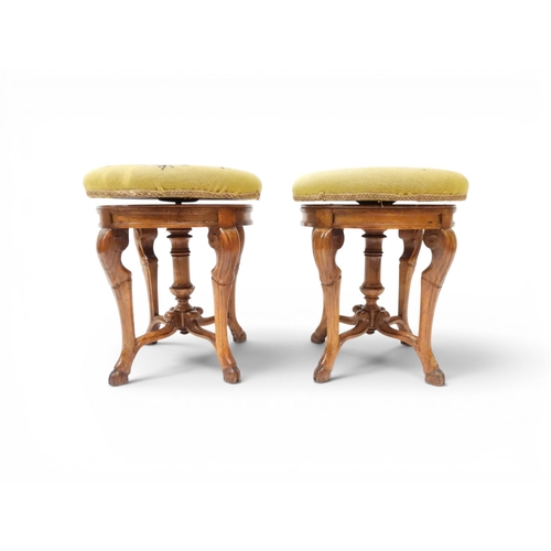 2027 - A PAIR OF 19TH CENTURY WALNUT RISE AND FALL PIANO STOOLS&nbsp;with circular mustard floral tapestry ... 