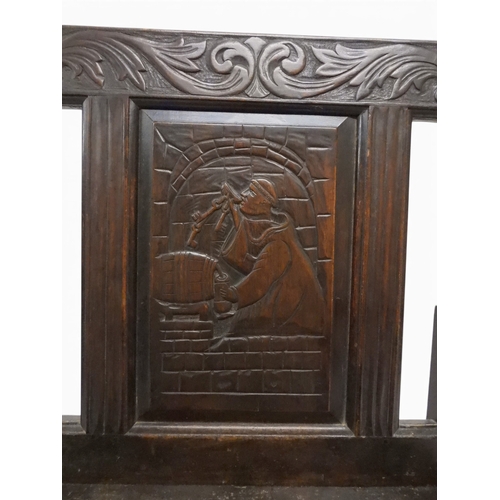 2029 - A 19TH CENTURY OAK WAINSCOT STYLE OAK ARMCHAIR&nbsp;with carved panel back depicting a monk tasting ... 