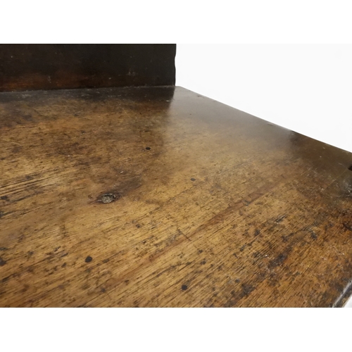 2029 - A 19TH CENTURY OAK WAINSCOT STYLE OAK ARMCHAIR&nbsp;with carved panel back depicting a monk tasting ... 