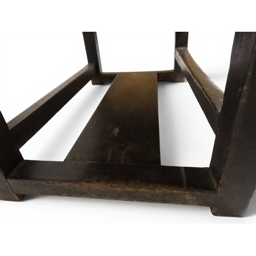 2029 - A 19TH CENTURY OAK WAINSCOT STYLE OAK ARMCHAIR&nbsp;with carved panel back depicting a monk tasting ... 