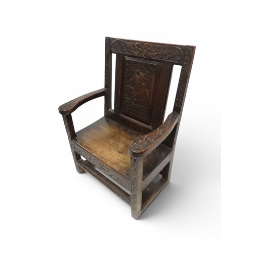 2029 - A 19TH CENTURY OAK WAINSCOT STYLE OAK ARMCHAIR&nbsp;with carved panel back depicting a monk tasting ... 