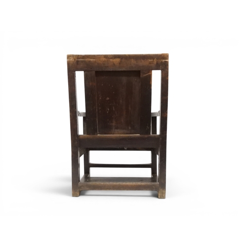 2029 - A 19TH CENTURY OAK WAINSCOT STYLE OAK ARMCHAIR&nbsp;with carved panel back depicting a monk tasting ... 