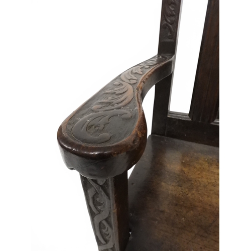 2029 - A 19TH CENTURY OAK WAINSCOT STYLE OAK ARMCHAIR&nbsp;with carved panel back depicting a monk tasting ... 