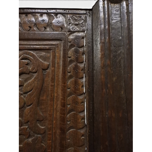2030 - A 18TH CENTURY OAK WAINSCOT STYLE OAK ARMCHAIR&nbsp;with panel back carved with foliate motifs over ... 