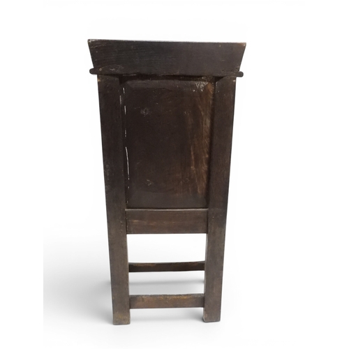 2030 - A 18TH CENTURY OAK WAINSCOT STYLE OAK ARMCHAIR&nbsp;with panel back carved with foliate motifs over ... 