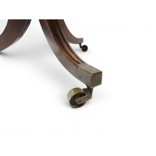 2037 - A GEORGIAN MAHOGANY TWO TIER DUMB WAITERwith two circular drop side tiers of graduating size on turn... 
