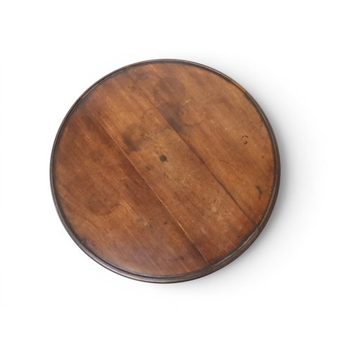 2037 - A GEORGIAN MAHOGANY TWO TIER DUMB WAITERwith two circular drop side tiers of graduating size on turn... 