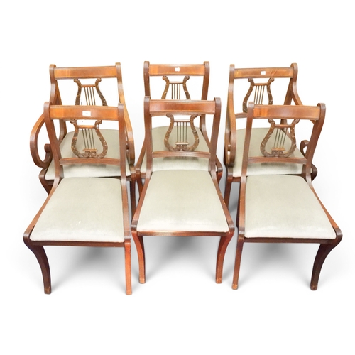 13 - A set of six (two carvers & four regular) regency style sabre legged dining chairs with stylized...