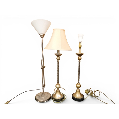 21 - A lot comprising a pair of contemporary metallic spiral based table lamps, 65cm high and a contempor...