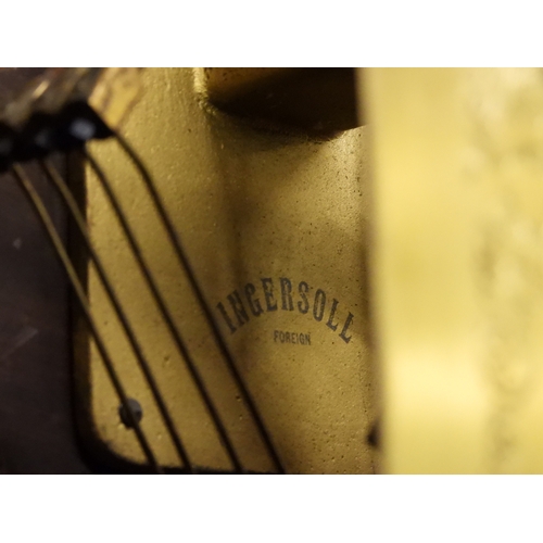 27 - An early 20th century oak cased Ingersoll longcase clock with brass dial bearing Arabic and Roman nu...