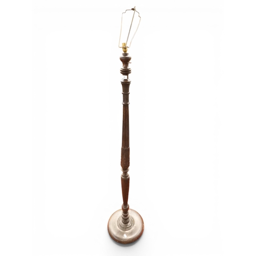 29 - An early 20th century stained oak standard lamp with turned reeded column with acanthus leaf decorat...