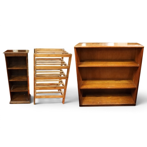 35 - A lot comprising an oak open bookcase, 96cm high x 88cm wide x 29cm deep, a smaller narrow oak open ...