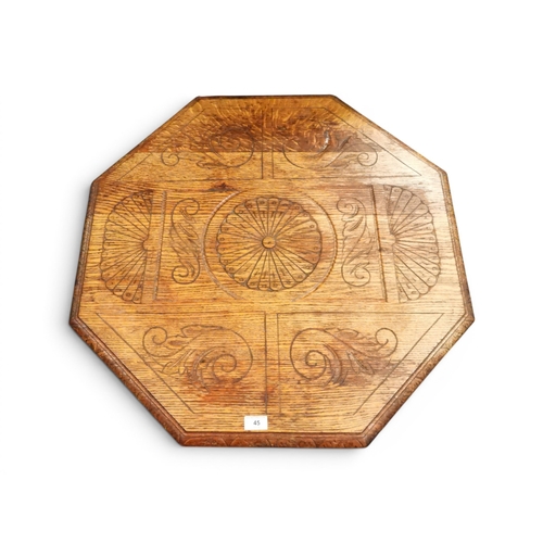 45 - An early 20th century blonde oak octagonal two tier window table with turned uprights and supports, ...
