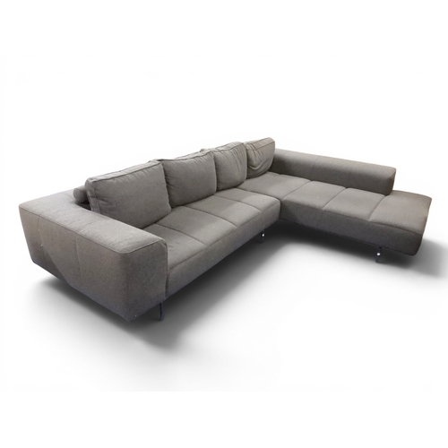 52 - A large contemporary BoConcept corner settee upholstered in slate gray fabric with four loose cushio...
