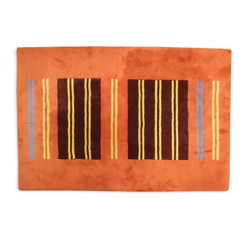 55 - A terracotta ground Handmade Rugs Ltd 