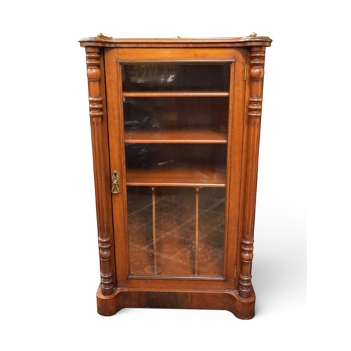 6 - A Victorian mahogany and burr walnut veneered music cabinet with brass galleried top over single gla...
