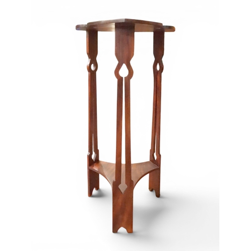 7 - An early 20th century mahogany Arts & Crafts two tier jardini&egrave;re stand with stylized fret...