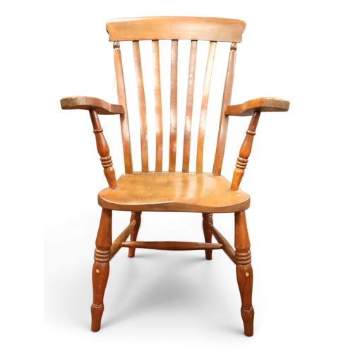 8 - A 19th century elm and beech framed high backed armchair with railed back over moulded seat flanked ...