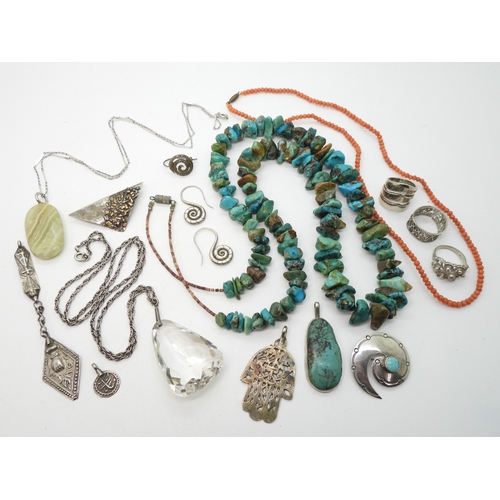 Three Native American jewels to include a string of turquoise and shell beads, a silver turquoise pendant signed Linc. Shepherd Navajo, and a further Navajo style turquoise brooch. Coral beads and other items