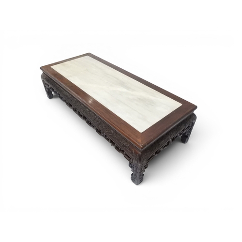 2005 - A LATE 19TH CENTURY CHINESE ROSEWOOD FRAMED OPIUM/COFFEE TABLE with rectangular marble inset top ove... 