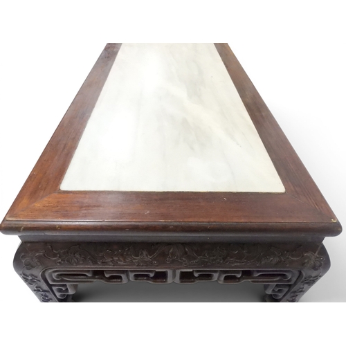 2005 - A LATE 19TH CENTURY CHINESE ROSEWOOD FRAMED OPIUM/COFFEE TABLE with rectangular marble inset top ove... 