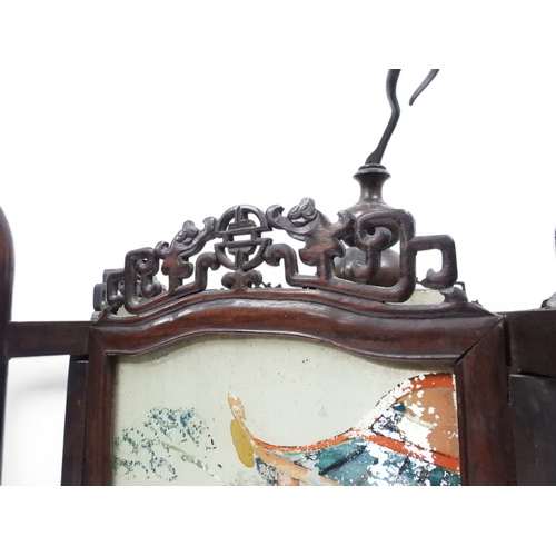 2006 - A LATE 19TH CENTURY CHINESE HARDWOOD FRAMED HEXAGONAL GLAZED LANTERNwith carved pierced frameworks a... 