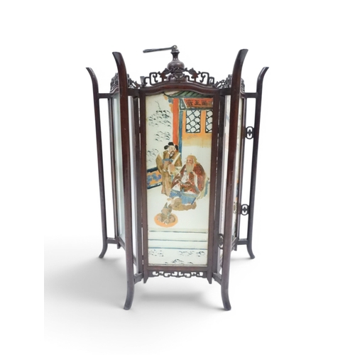 2006 - A LATE 19TH CENTURY CHINESE HARDWOOD FRAMED HEXAGONAL GLAZED LANTERNwith carved pierced frameworks a... 
