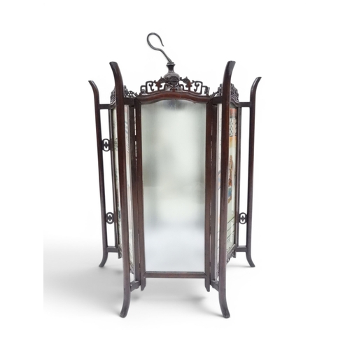 2006 - A LATE 19TH CENTURY CHINESE HARDWOOD FRAMED HEXAGONAL GLAZED LANTERNwith carved pierced frameworks a... 