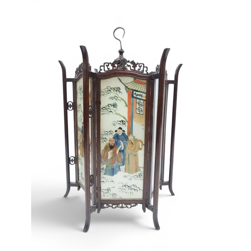 2006 - A LATE 19TH CENTURY CHINESE HARDWOOD FRAMED HEXAGONAL GLAZED LANTERNwith carved pierced frameworks a... 