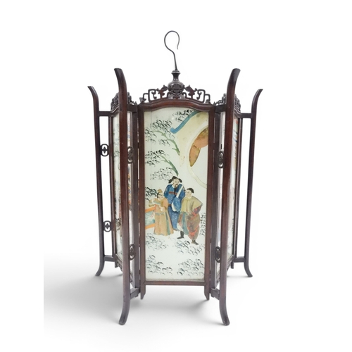 2006 - A LATE 19TH CENTURY CHINESE HARDWOOD FRAMED HEXAGONAL GLAZED LANTERNwith carved pierced frameworks a... 