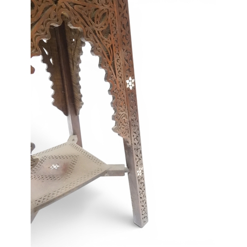 2008 - A LATE 19TH CENTURY MOORISH STYLE TWO TIER OCCASIONAL TABLE square top extensively carved with Arabi... 