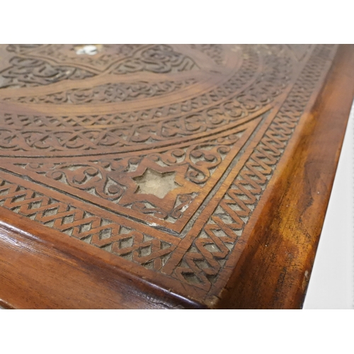 2008 - A LATE 19TH CENTURY MOORISH STYLE TWO TIER OCCASIONAL TABLE square top extensively carved with Arabi... 