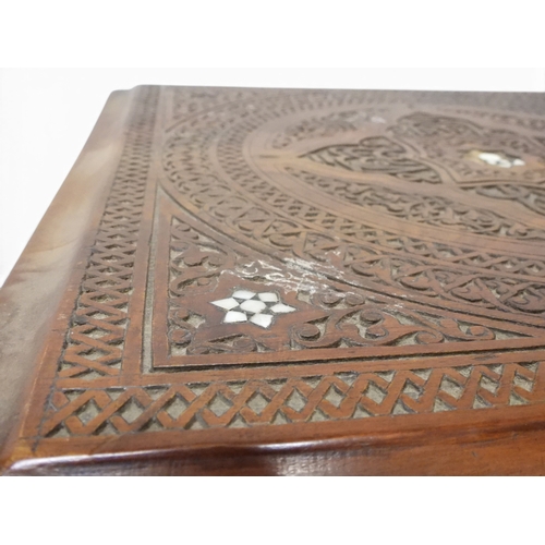 2008 - A LATE 19TH CENTURY MOORISH STYLE TWO TIER OCCASIONAL TABLE square top extensively carved with Arabi... 