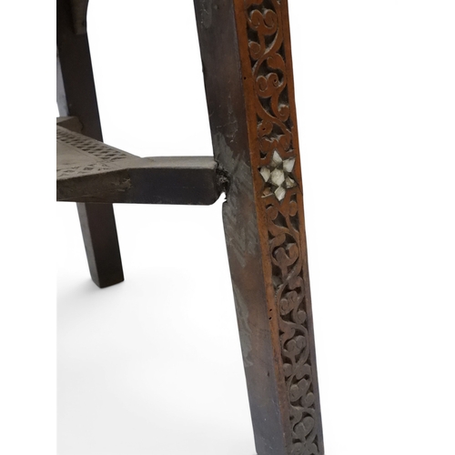 2008 - A LATE 19TH CENTURY MOORISH STYLE TWO TIER OCCASIONAL TABLE square top extensively carved with Arabi... 