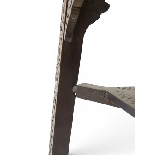 2008 - A LATE 19TH CENTURY MOORISH STYLE TWO TIER OCCASIONAL TABLE square top extensively carved with Arabi... 