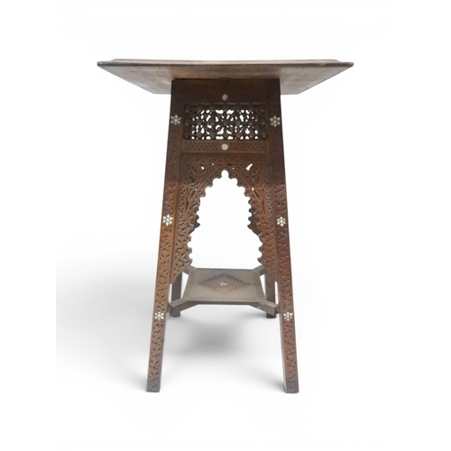 2008 - A LATE 19TH CENTURY MOORISH STYLE TWO TIER OCCASIONAL TABLE square top extensively carved with Arabi... 