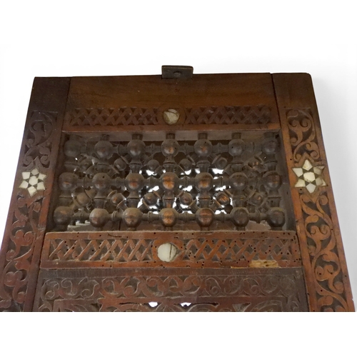 2008 - A LATE 19TH CENTURY MOORISH STYLE TWO TIER OCCASIONAL TABLE square top extensively carved with Arabi... 