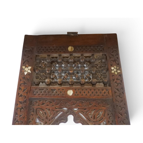 2008 - A LATE 19TH CENTURY MOORISH STYLE TWO TIER OCCASIONAL TABLE square top extensively carved with Arabi... 