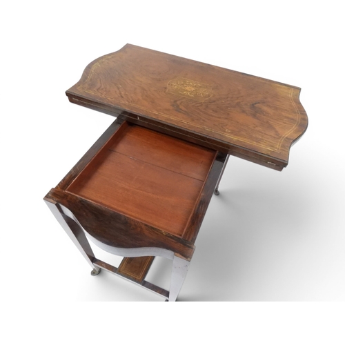 2016 - A VICTORIAN ROSEWOOD AND SATINWOOD INLAID FOLD-OVER CARD TABLE&nbsp;shaped top concealing baize line... 