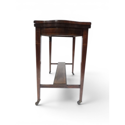 2016 - A VICTORIAN ROSEWOOD AND SATINWOOD INLAID FOLD-OVER CARD TABLE&nbsp;shaped top concealing baize line... 