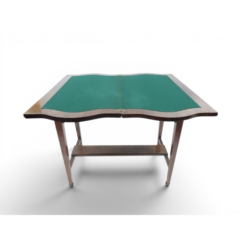 2016 - A VICTORIAN ROSEWOOD AND SATINWOOD INLAID FOLD-OVER CARD TABLE&nbsp;shaped top concealing baize line... 