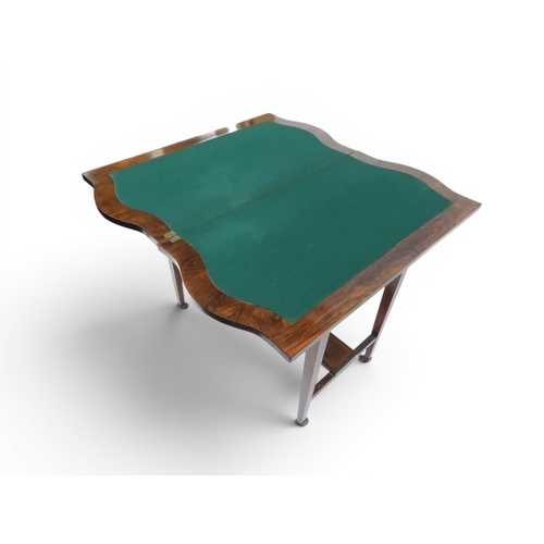 2016 - A VICTORIAN ROSEWOOD AND SATINWOOD INLAID FOLD-OVER CARD TABLE&nbsp;shaped top concealing baize line... 