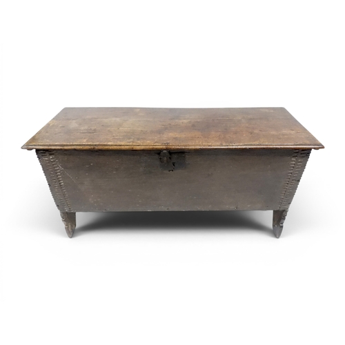 2020 - AN 18TH CENTURY OAK SWORD CHESTwith two plank hinged lid with wrought iron fittings on fret cut supp... 