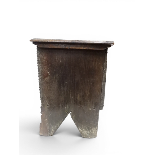 2020 - AN 18TH CENTURY OAK SWORD CHESTwith two plank hinged lid with wrought iron fittings on fret cut supp... 