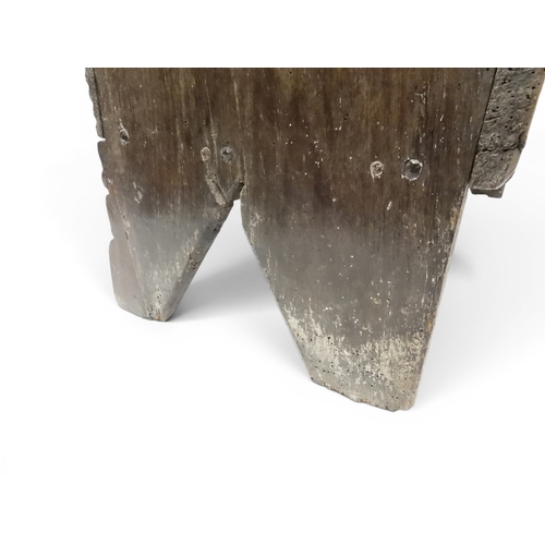2020 - AN 18TH CENTURY OAK SWORD CHESTwith two plank hinged lid with wrought iron fittings on fret cut supp... 